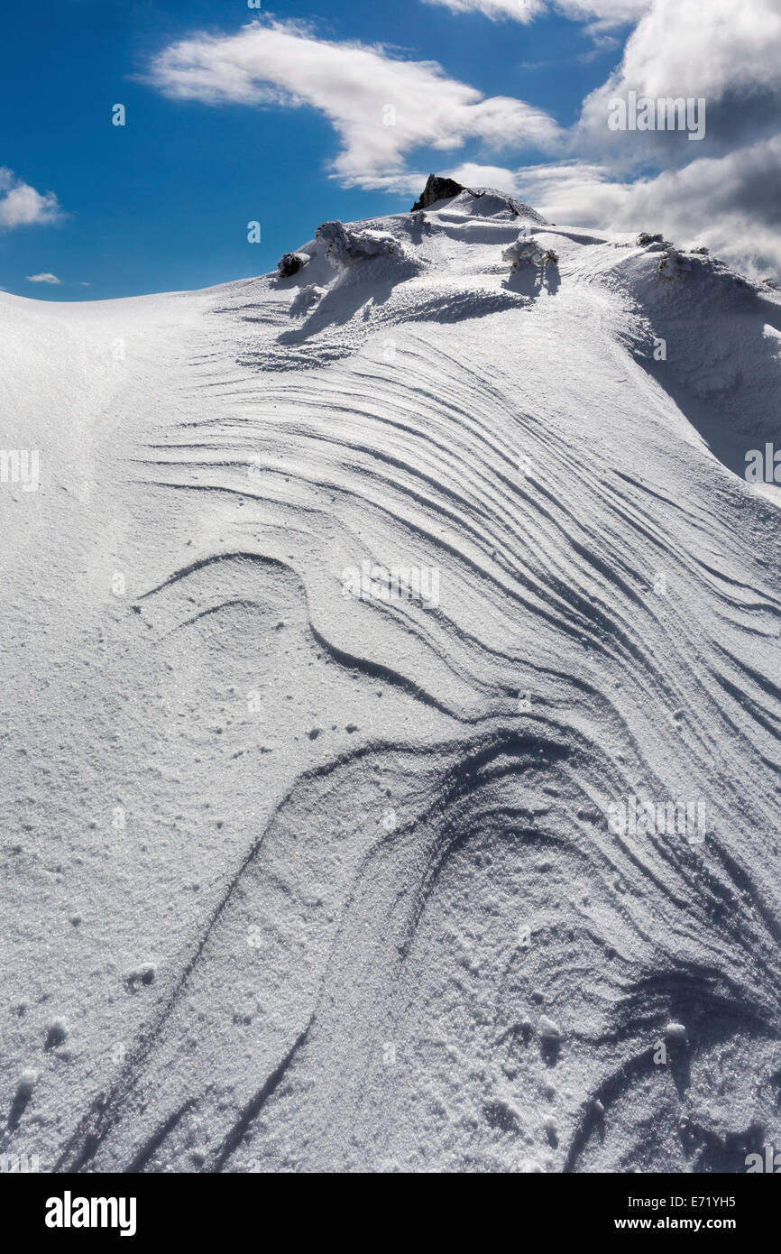 Overhanging snow with wind grooves or Sastrugi ridges, at Mt Wildkamm, Niederalpl, Mürzsteg Alps, Styria, Austria Stock Photo