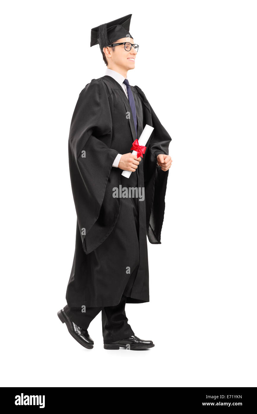 Graduate student walking with diploma in his hand isolated on white