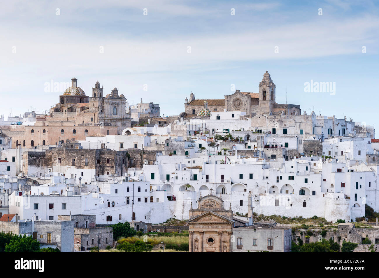 View of the town with the cathedral, right, and the church Chiesa delle Monacelle, left, Ostuni, Apulia, Italy Stock Photo