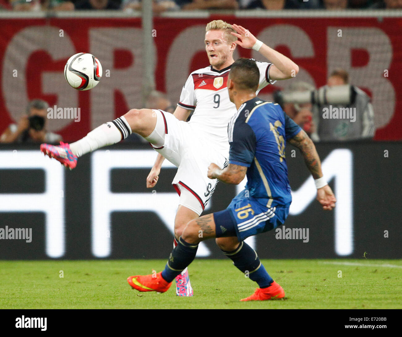 Duesseldorf, Germany. 03rd Sep, 2014. Germany's Andre Schuerrle (L) Argentina's Marcos Rojo vie for the ball during international soccer match between Germany and Argentina at Esprit arena in Duesseldorf, Germany, 03 September 2014. Photo: Roland Weihrauch/dpa/Alamy Live News Stock Photo