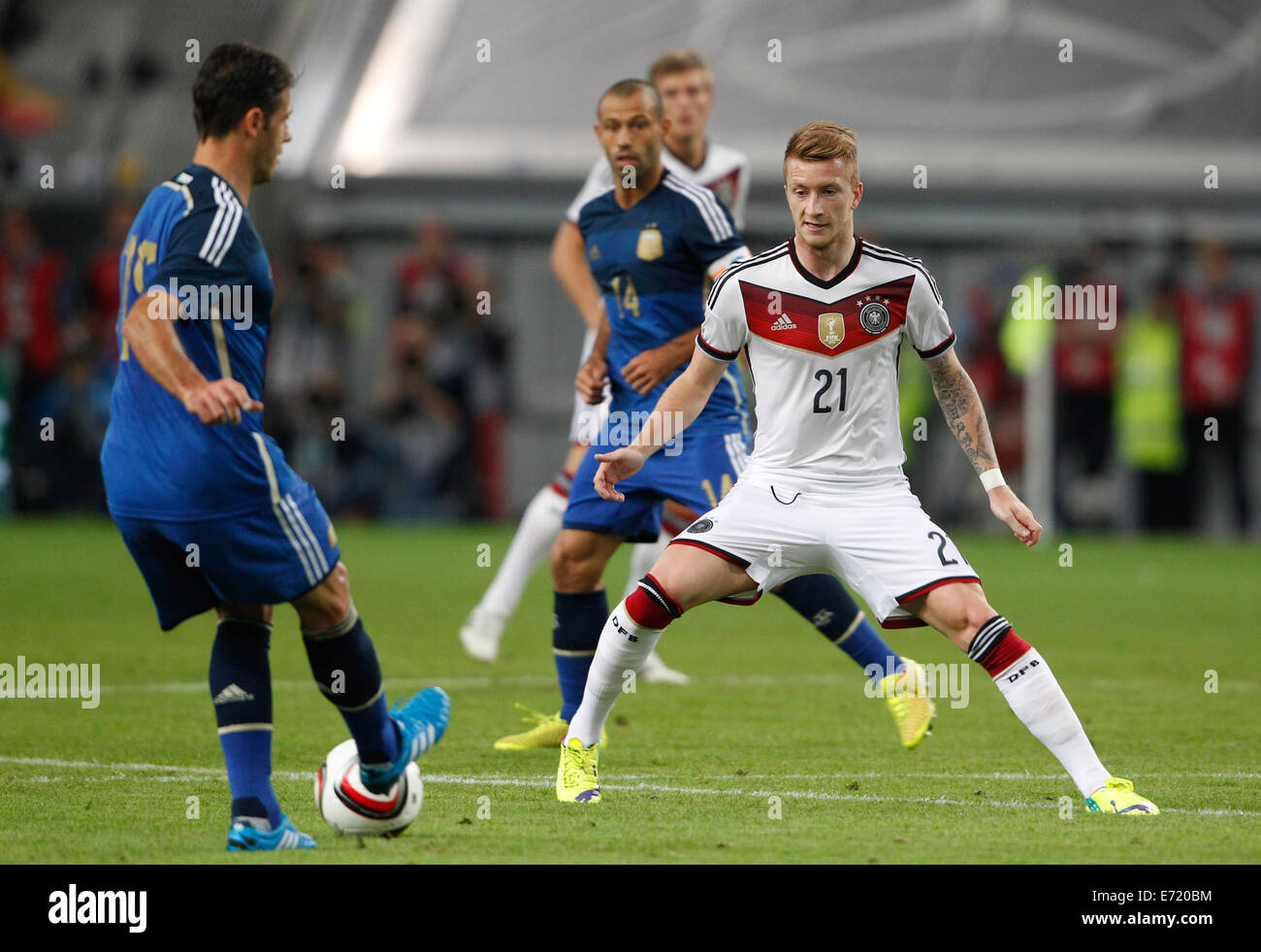Duesseldorf, Germany. 03rd Sep, 2014. Germany's Marco Reus (R) and Argentina's Martin Demichelis vie for the ball during international soccer match between Germany and Argentina at Esprit arena in Duesseldorf, Germany, 03 September 2014. Photo: Roland Weihrauch/dpa/Alamy Live News Stock Photo