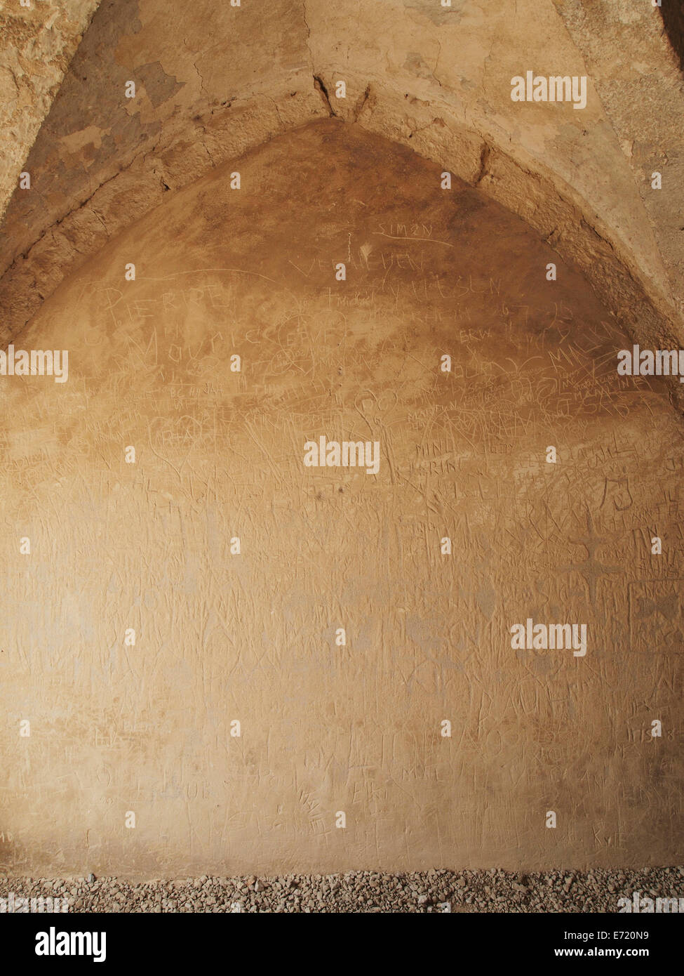 Names scratched into the wall under the gate of the Baume les Messieurs abbey, Jura region, France Stock Photo