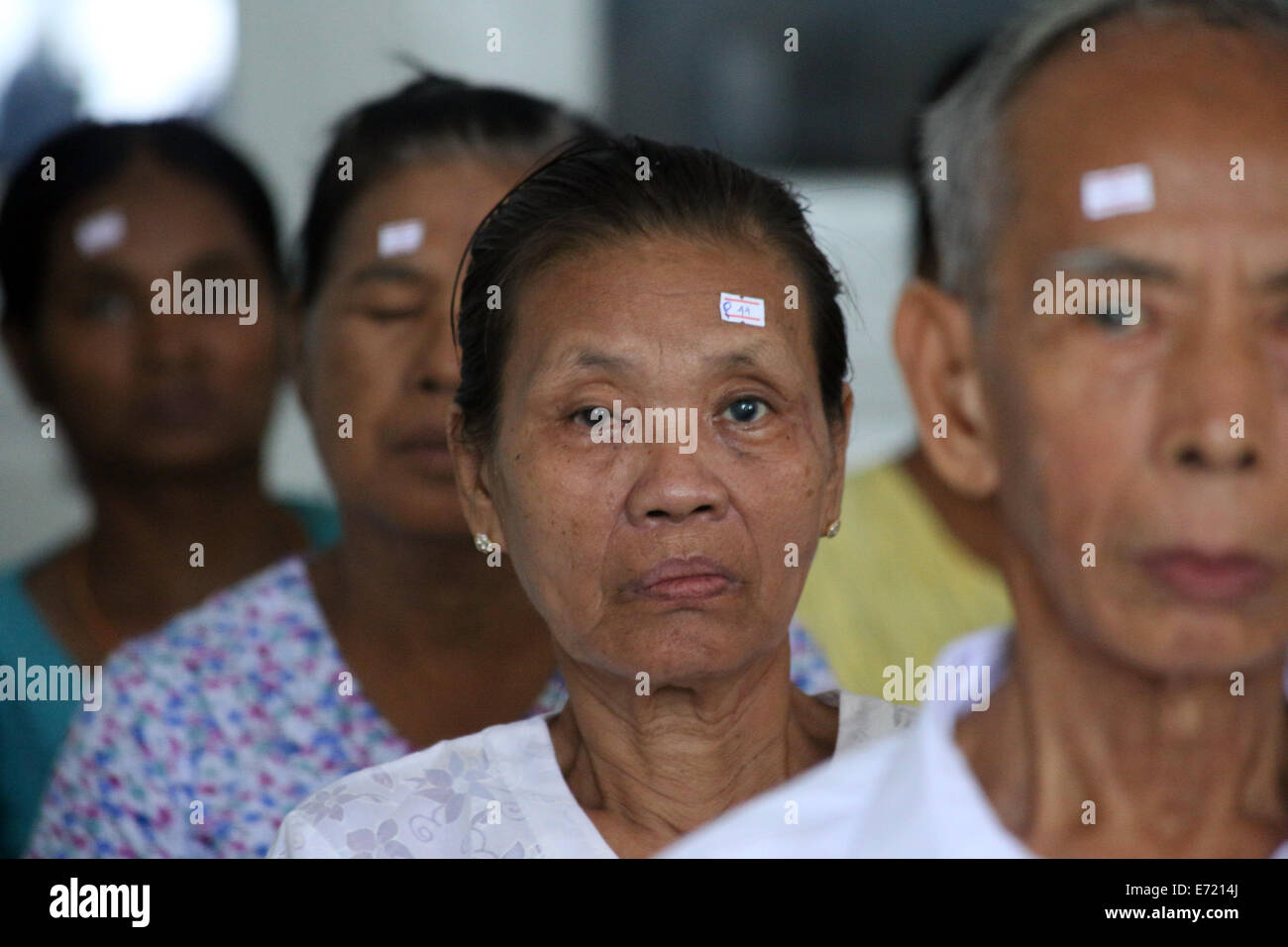 Yangon, Myanmar. 4th Sep, 2014. Patients wait for eye surgical treatment in Yangon, Myanmar, Sept. 4, 2014. A Chinese medical team started a free eye surgical treatment campaign in Yangon Thursday as the third of its kind of 'Brightness Action' in the country. Credit:  U Aung/Xinhua/Alamy Live News Stock Photo