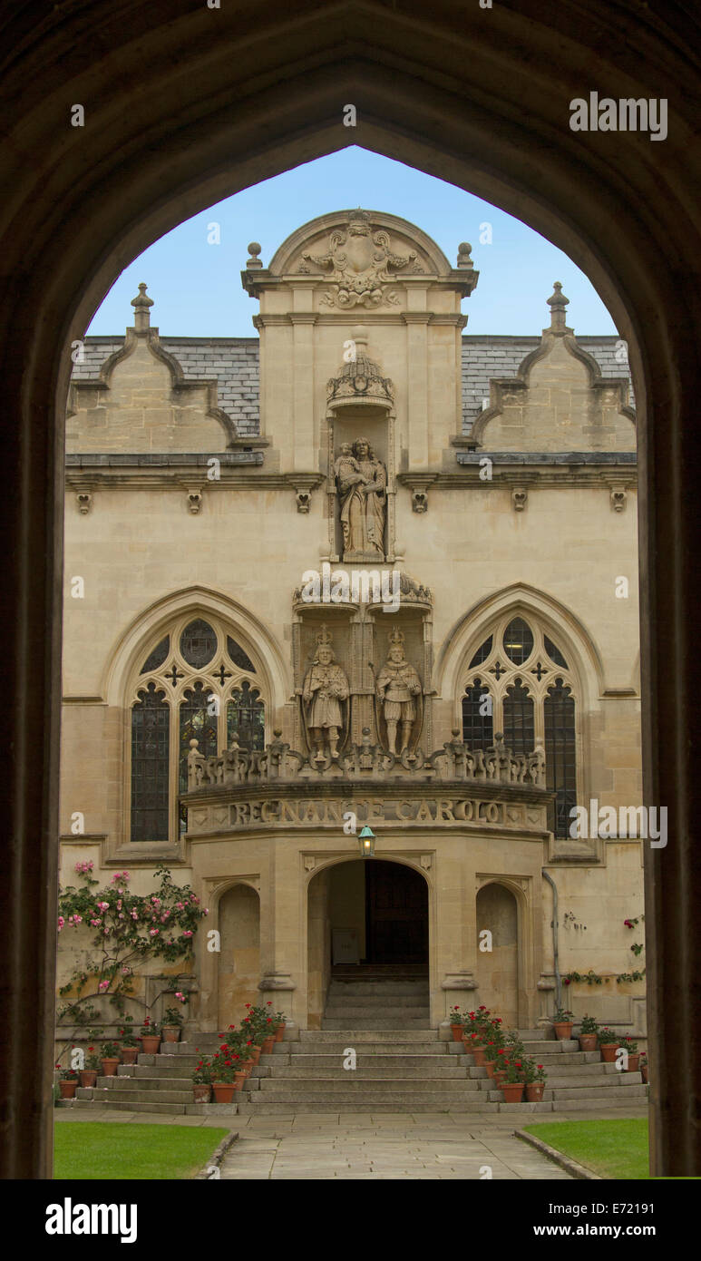 Ornate exterior and entrance to historic Oriel college in Oxford, England viewed through archway Stock Photo