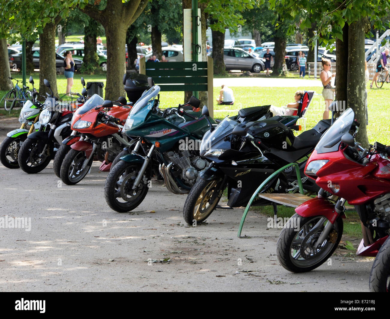 Line of parked motorcycles at Domaine the Chalain, Jura, France Stock Photo
