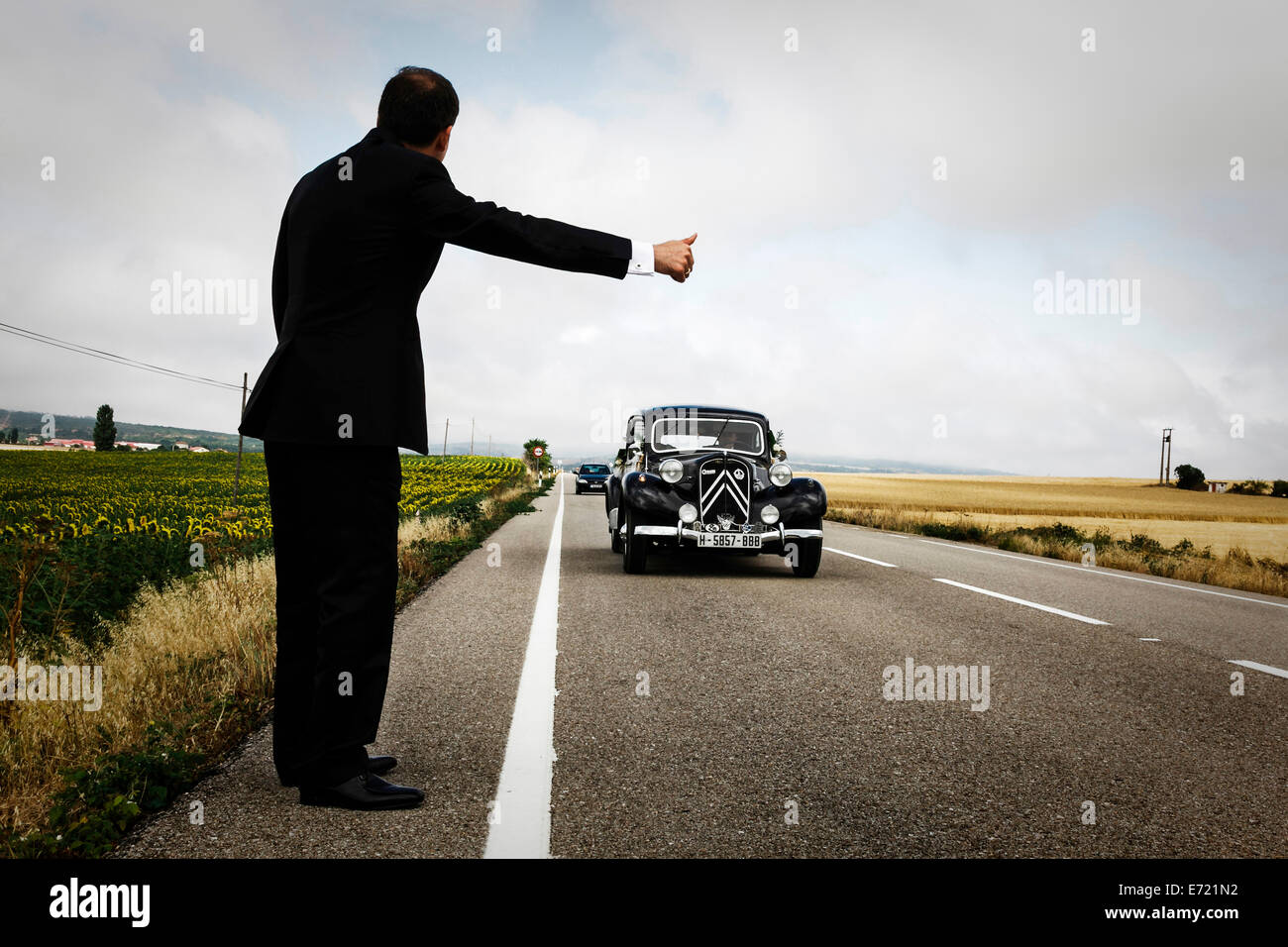 Groom hitching on a road. Car wedding. Navarre. Spaipn Stock Photo - Alamy