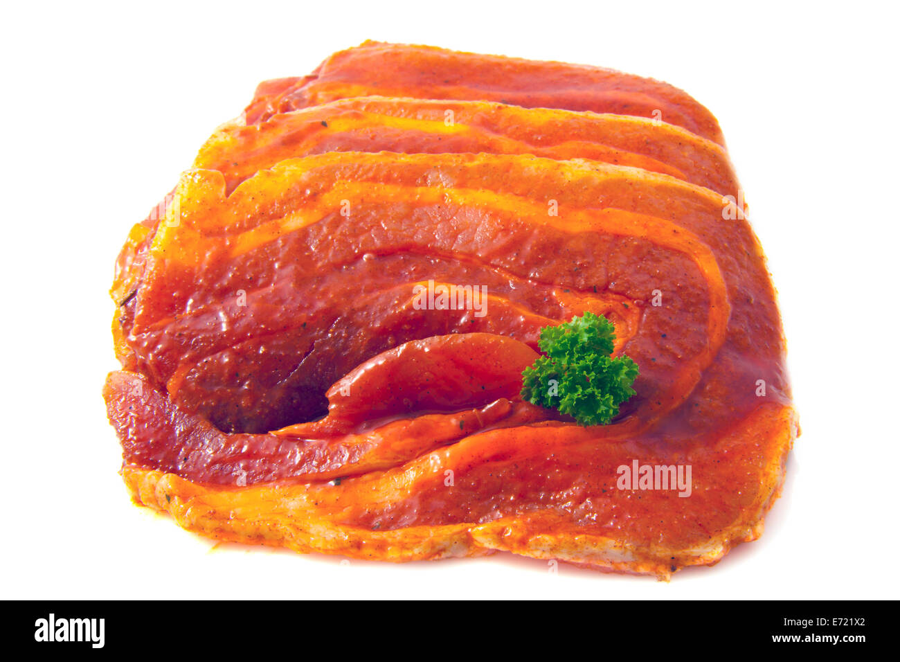 Raw chops with herbs isolated over white Stock Photo