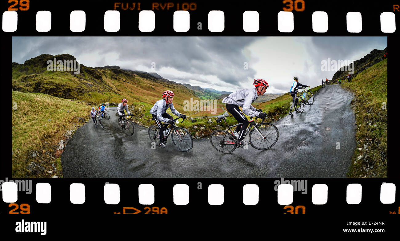 Action sequence of a cyclist climbing Hardknott Pass Stock Photo