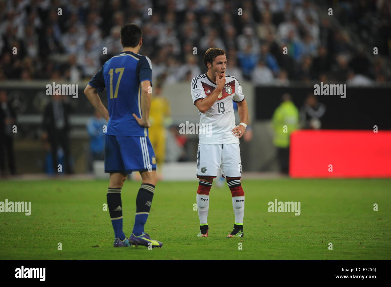 Esprit Arena, Duesseldorf, Germany. 3rd Sep, 2014. Germany's Mario Goetze and Argentina's Federico Fernandez stand on the pitch during the soccer friendly between Germany and Argentina at Esprit Arena, Duesseldorf, Germany, 3 September 2014. Photo: Jonas Guettler/dpa/Alamy Live News Stock Photo