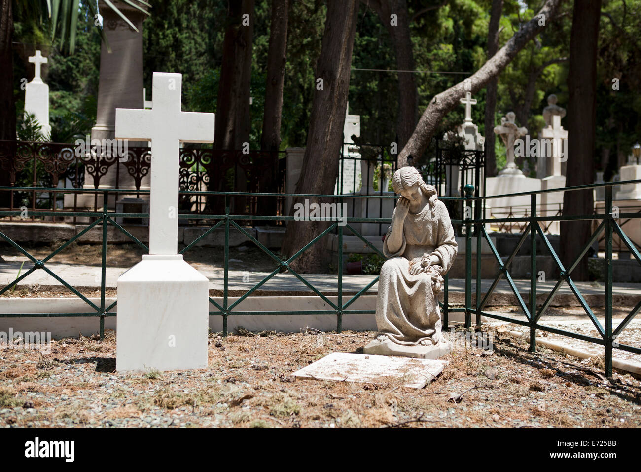 Cemetery angel and a cross, Athens A' Cemetery Stock Photo