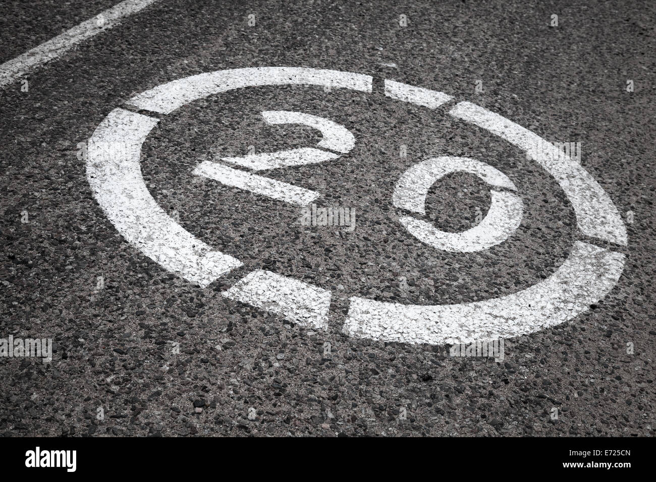 Speed limit road sign on gray asphalt Stock Photo