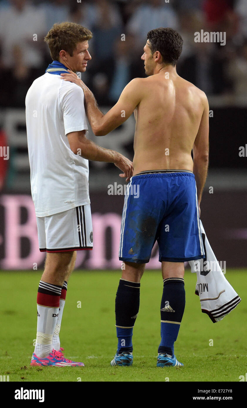 Duesseldorf, Germany. 03rd Sep, 2014. Germany's Thomas Mueller (L) and Argentina's Martin Demichelis exchange jerseys after the international match between Germany and Argentina at Esprit arena in Duesseldorf, Germany, 03 September 2014. Photo: Bernd Thissen/dpa/Alamy Live News Stock Photo