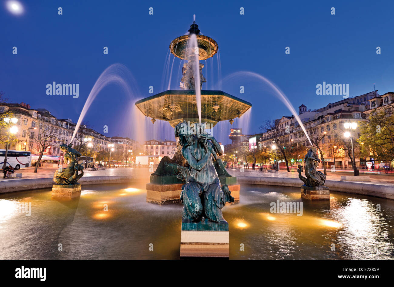 Portugal, Lisbon: Nocturnal illuminated fountain at Rossio Square Stock Photo