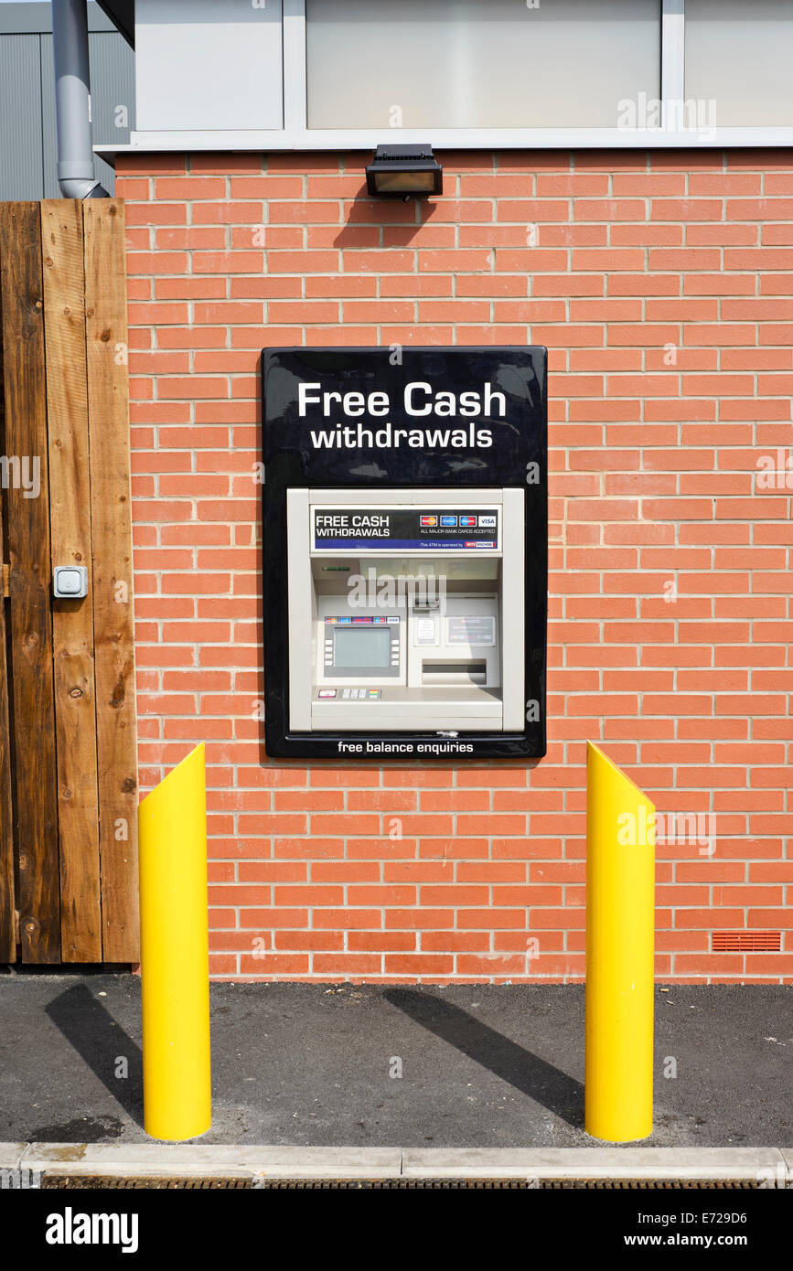 Cash Dispenser built into the wall of a Morrisons Local supermarket Stock Photo