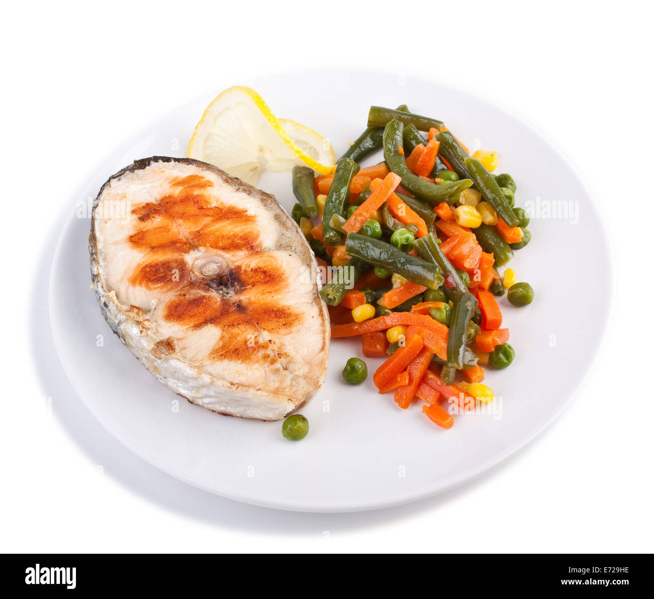 Grilled Salmon Steak with Vegetables and Lemon Stock Photo - Alamy