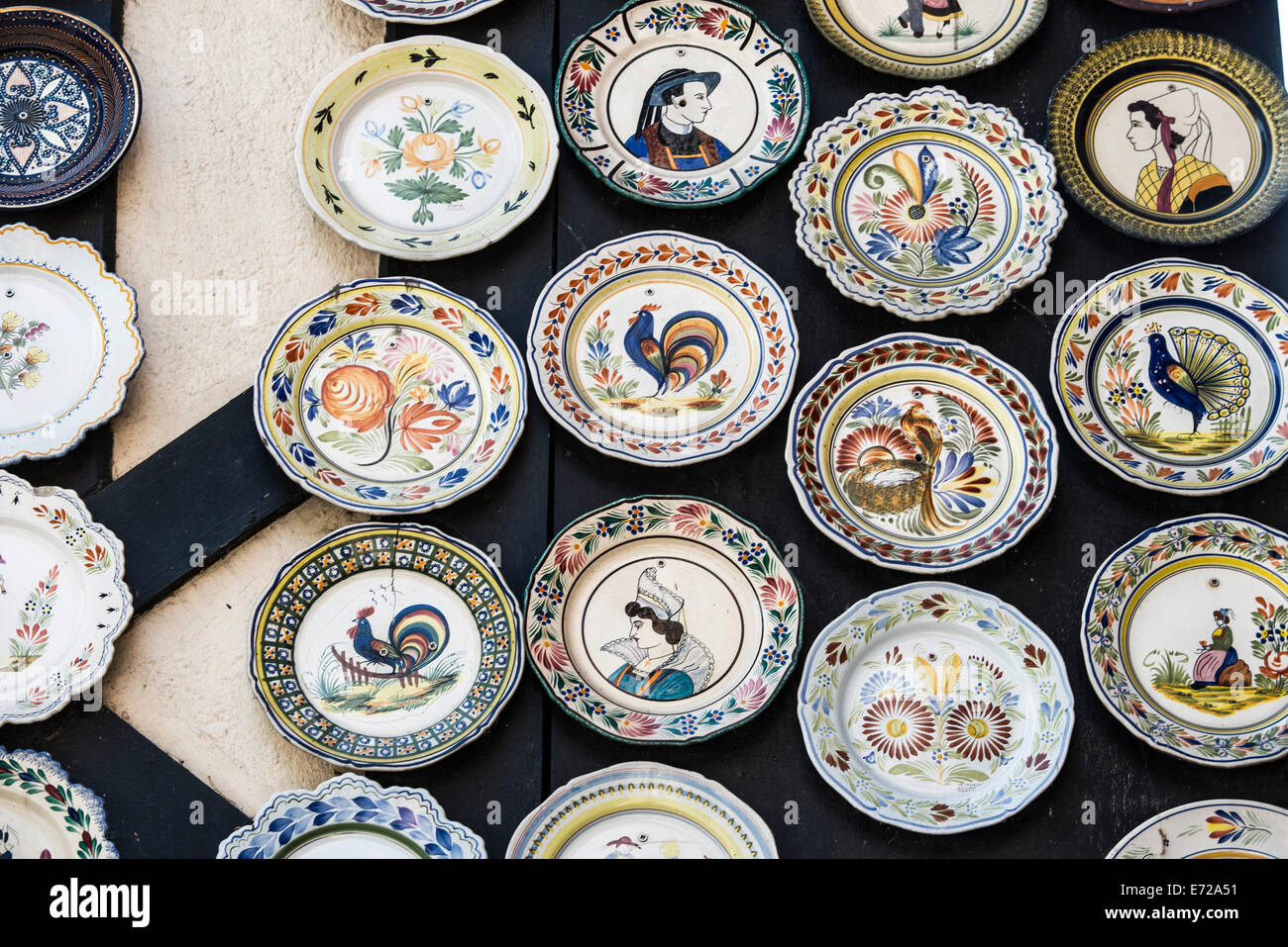 Faience ware, typical painted earthenware plates, Quimper, Brittany, France Stock Photo