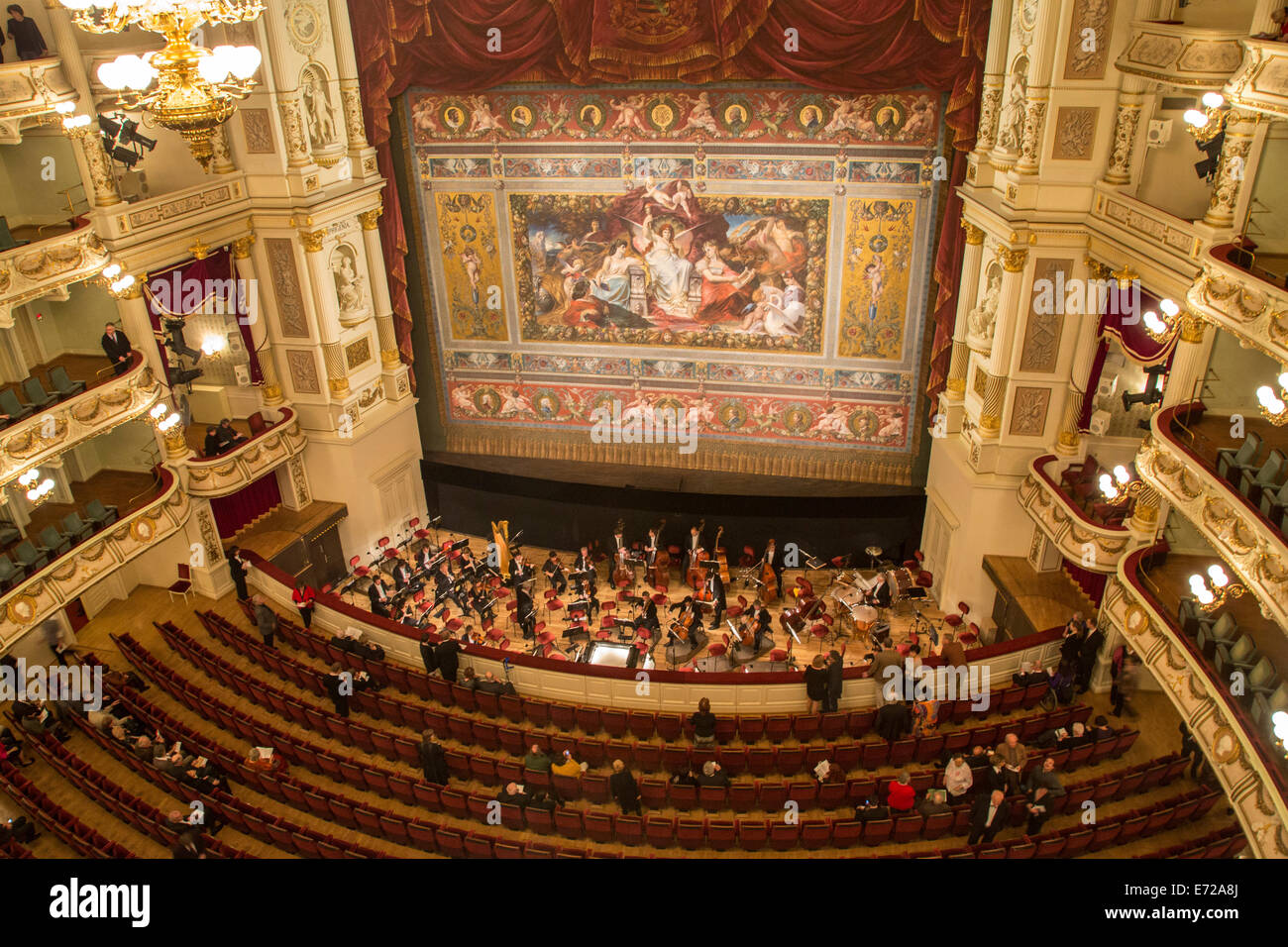 Interior view of the Semperoper opera house, concert hall with a huge curtain and the orchestra, seen from the top gallery Stock Photo