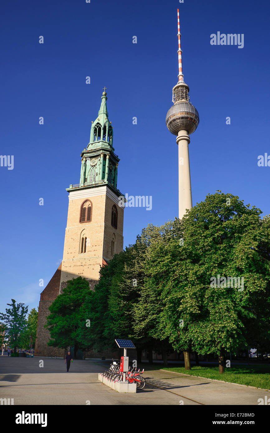 Germany, Berlin, Fernsehturm  Berlins TV Tower overlooking Marienkirche also known as St Marys Church. Stock Photo