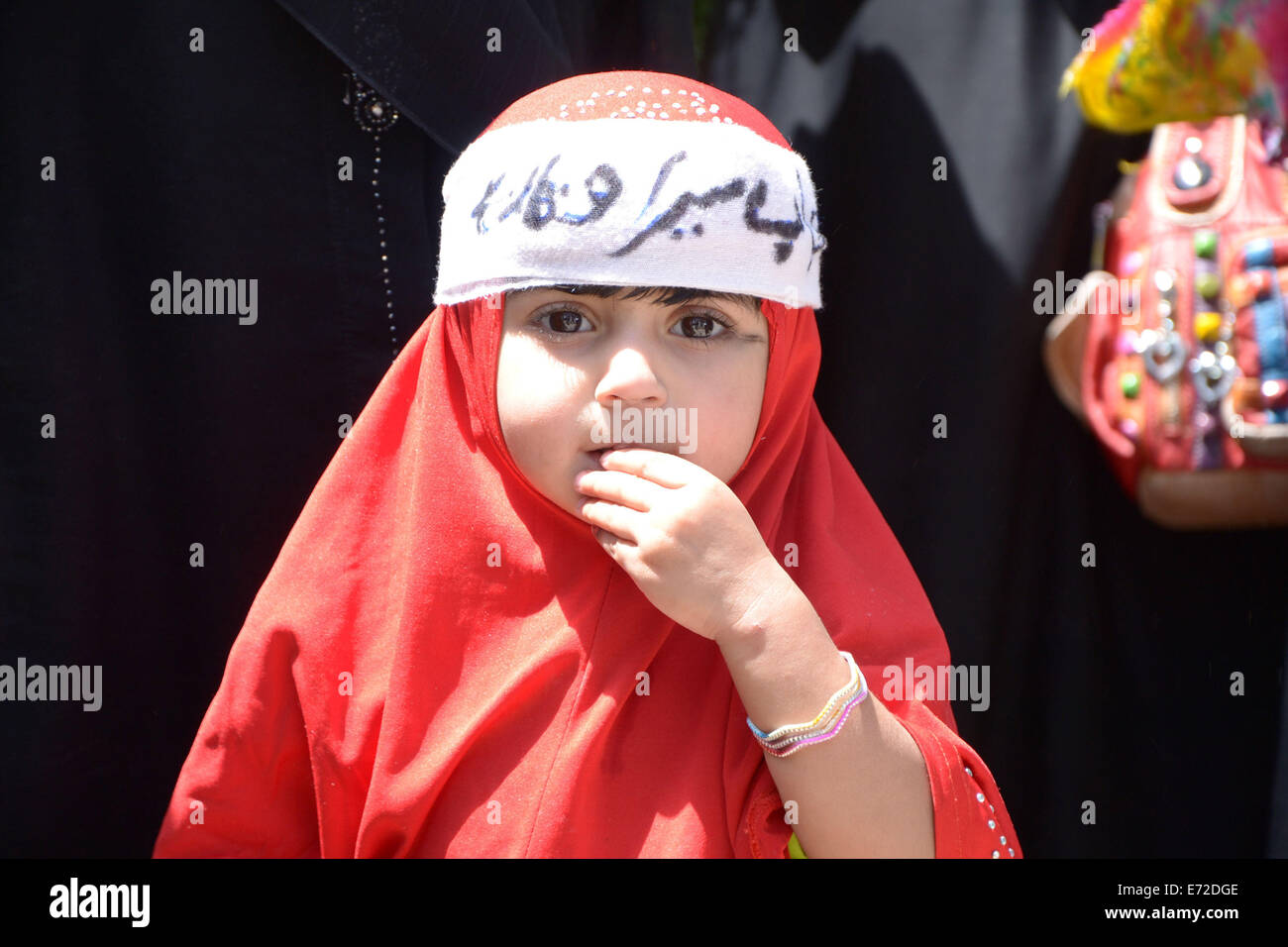 Quetta. 4th Sep, 2014. A Pakistani girl wears hijab during a rally to mark World Hijab Day in southwest Pakistan's Quetta, Sept. 4, 2014. Nationwide rallies were organized to highlight the importance and value of hijab for Muslim women in Pakistan. Credit:  Asad/Xinhua/Alamy Live News Stock Photo