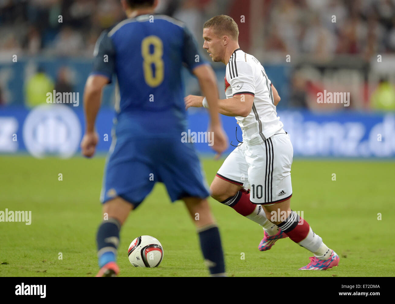 Duesseldorf, Germany. 03rd Sep, 2014. Argentina's Enzo Perez (L) and Germany's Lukas Podolski vie for the ball during the international match between Germany and Argentina at Esprit Arena in Duesseldorf, Germany, 03 September 2014. Photo: Federico Gambarini/dpa/Alamy Live News Stock Photo