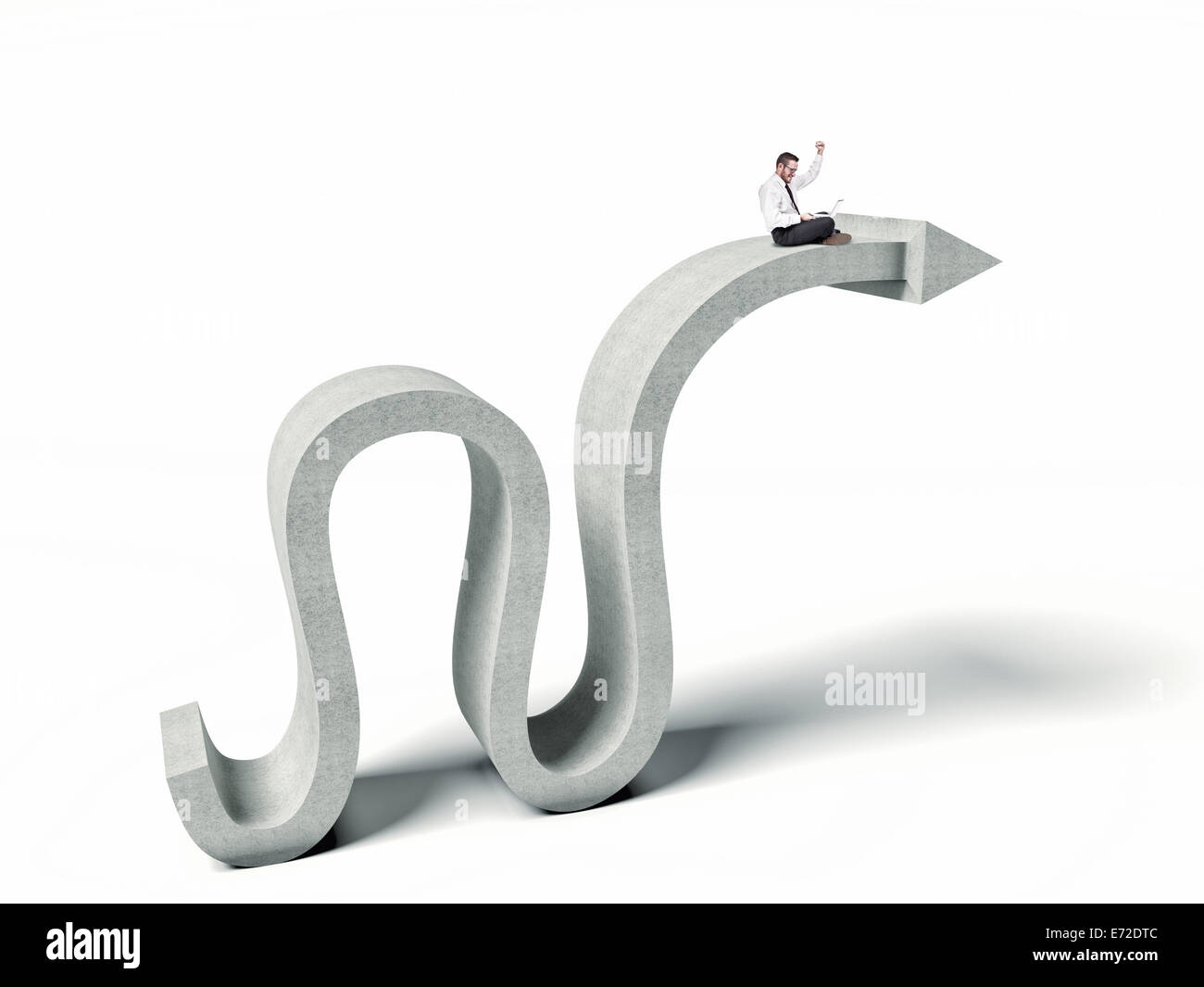 business man with pc on abstract concrete arrow Stock Photo