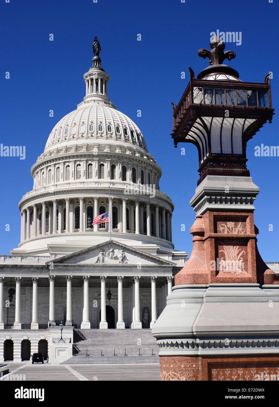USA, Washington DC, Capitol Building  Head on view of the central section with its dome and lampstand in the foreground. Stock Photo