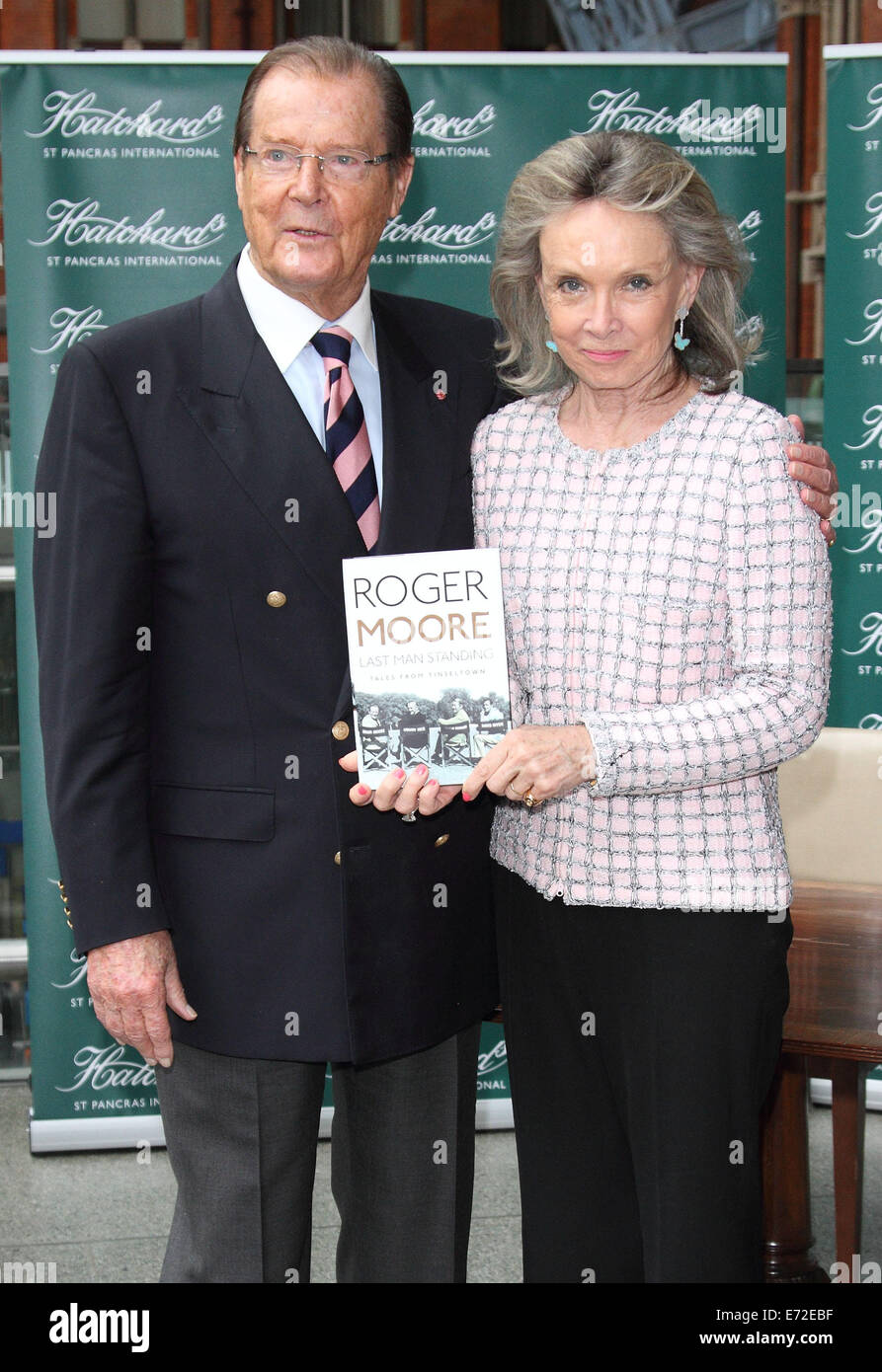 London, UK. 4th September, 2014. Sir Roger Moore - pictured with wife, Kristina Tholstrup - signs copies of his autobiography 'Last Man Standing: Tales From Tinseltown', at Hatchards St Pancras Station, on September 04 2014 in London, England   Credit:  KEITH MAYHEW/Alamy Live News Stock Photo