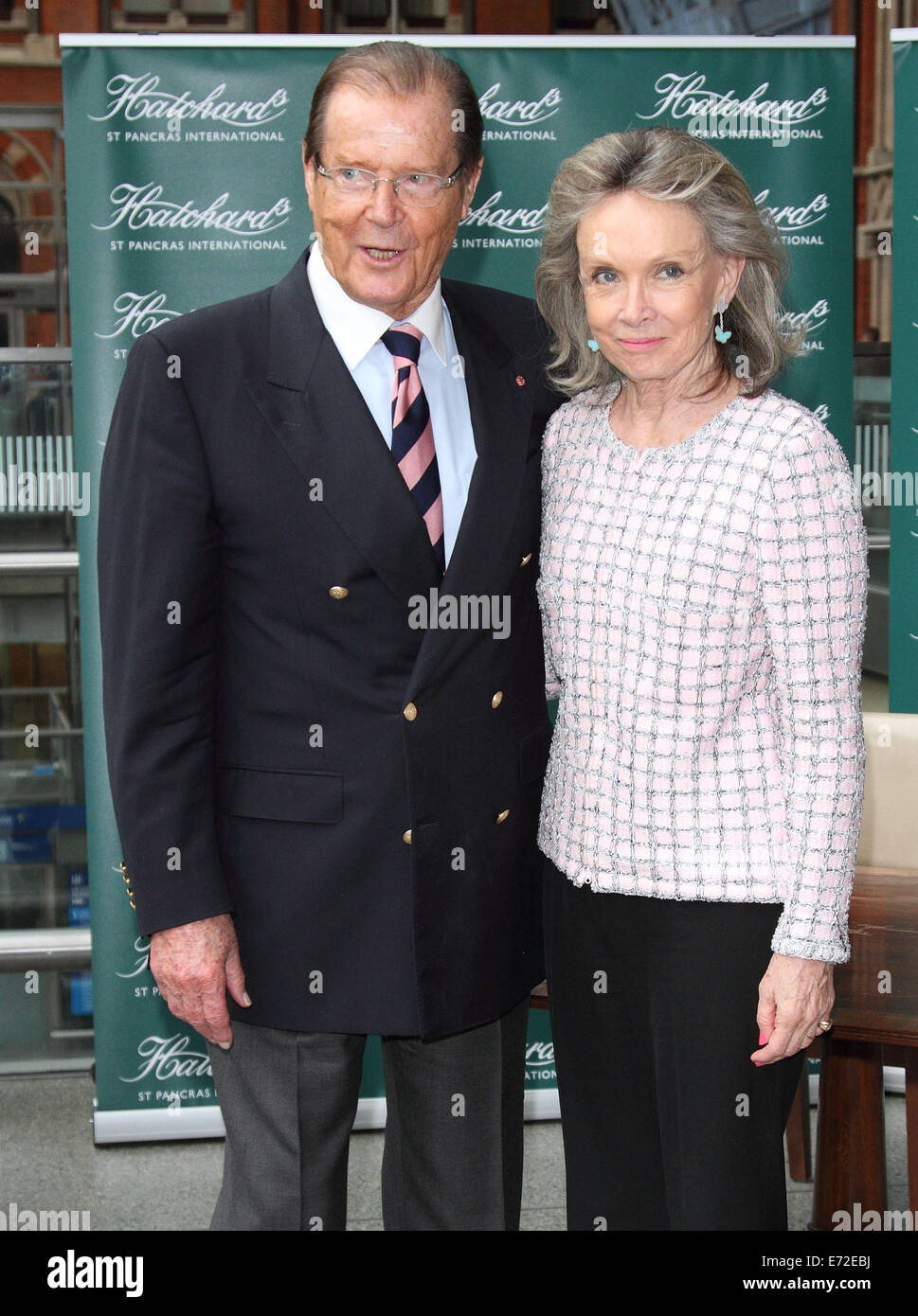 London, UK. 4th September, 2014. Sir Roger Moore - pictured with wife, Kristina Tholstrup - signs copies of his autobiography 'Last Man Standing: Tales From Tinseltown', at Hatchards St Pancras Station, on September 04 2014 in London, England   Credit:  KEITH MAYHEW/Alamy Live News Stock Photo