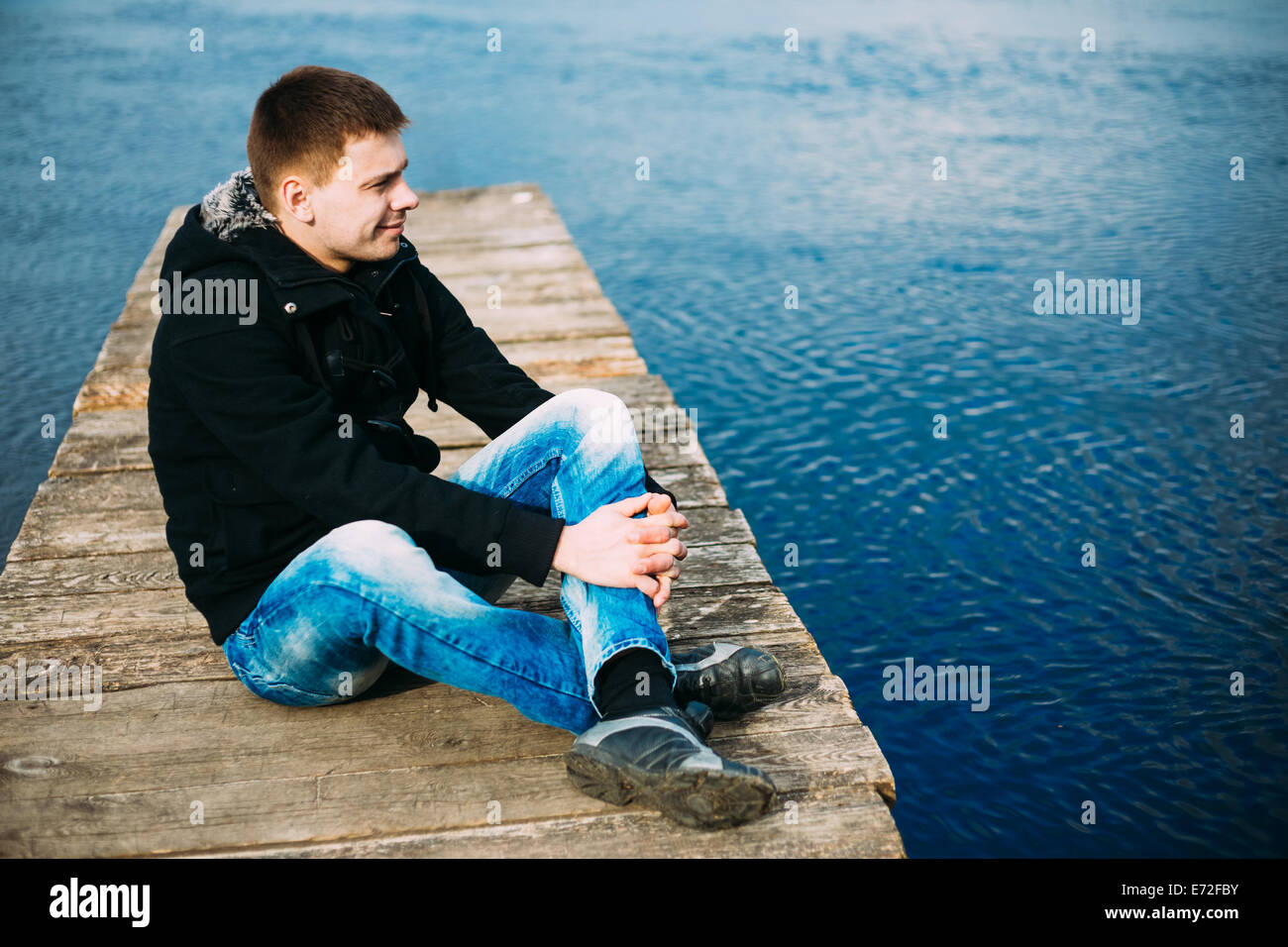 Sad pensive man sitting river hi-res stock photography and images - Alamy