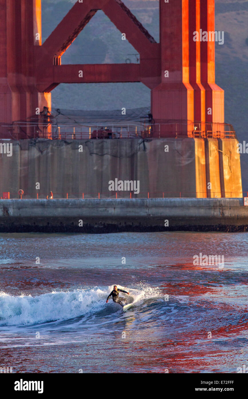 Sunrise surfing action under the Golden Gate Bridge in San Francisco