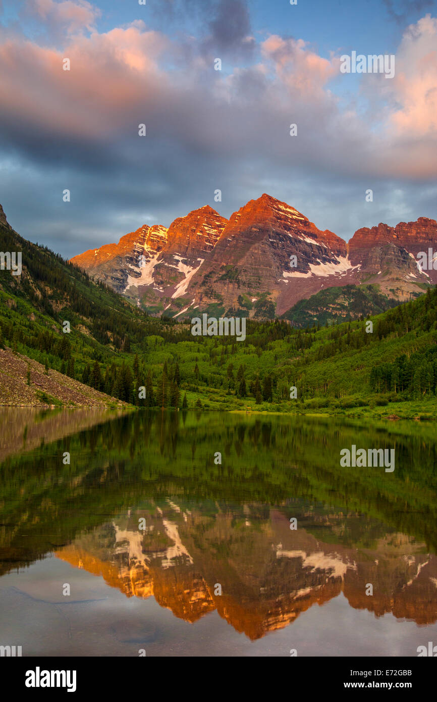 Maroon Bells reflect into calm Maroon Lake near Aspen, Colorado, USA