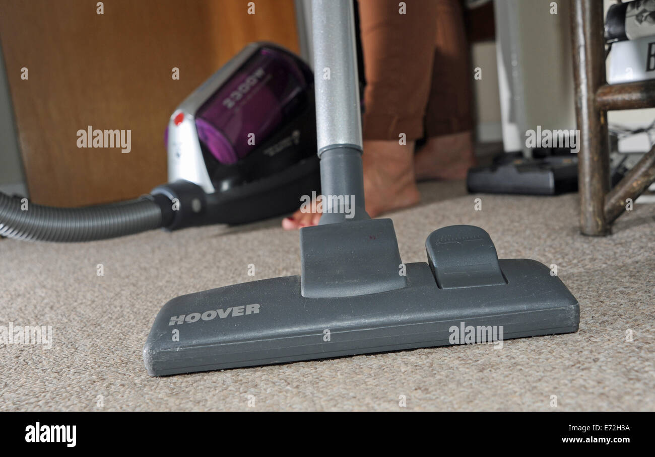 Powerful pull along Hoover vacuum cleaner being used on domestic carpet