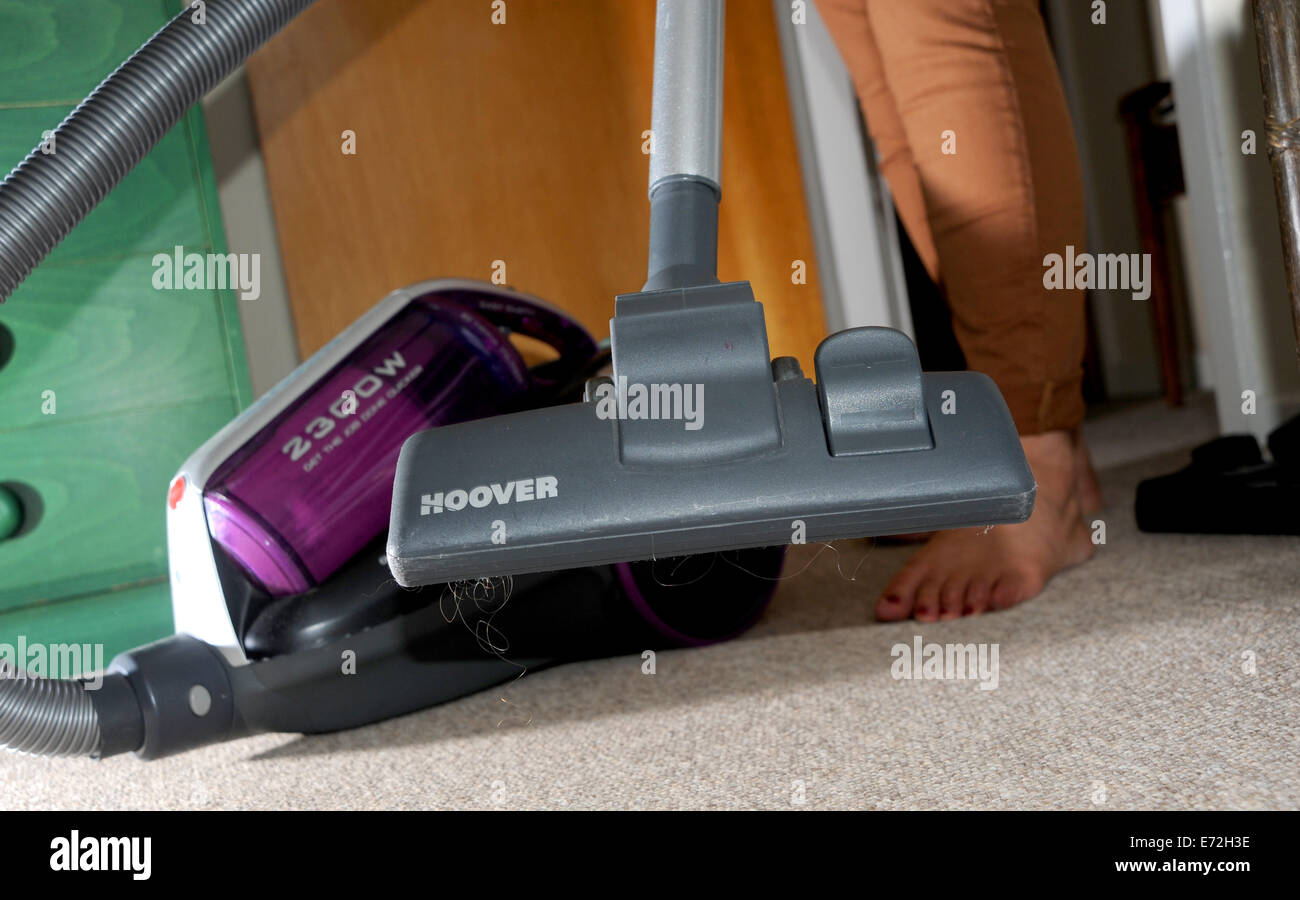 Powerful pull along Hoover vacuum cleaner being used on domestic carpet