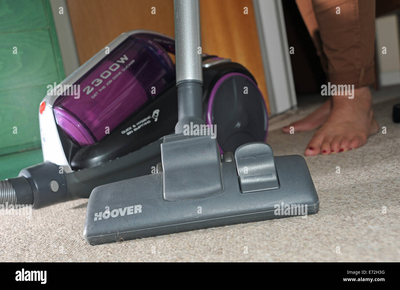 Powerful pull along Hoover vacuum cleaner being used on domestic carpet