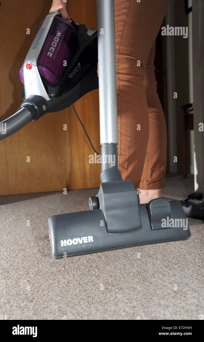 Powerful pull along Hoover vacuum cleaner being used on domestic carpet
