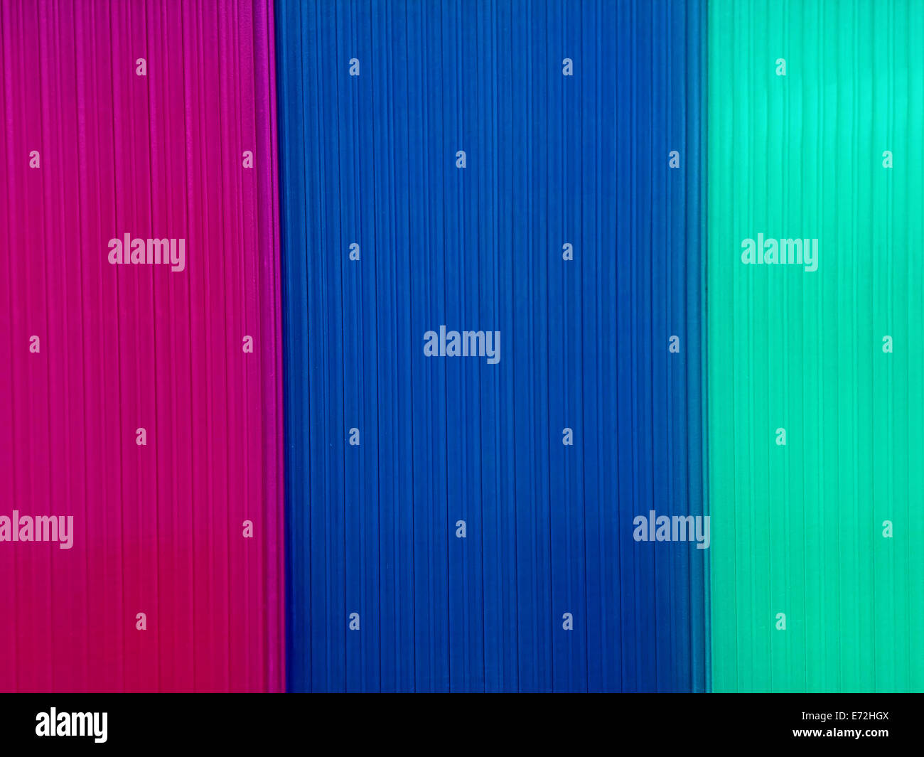 Background with multicolored polycarbonate plates that are used in construction. Stock Photo