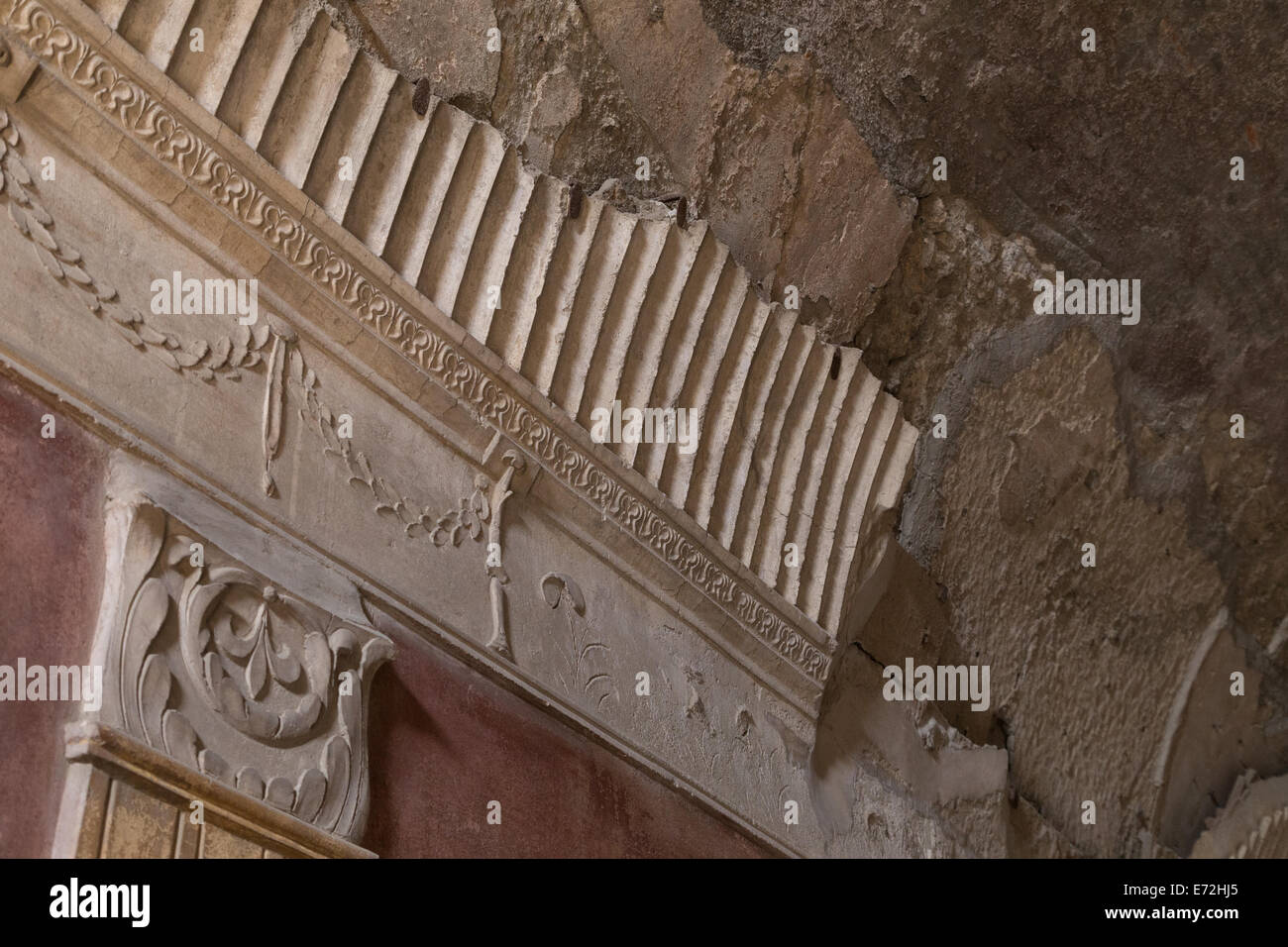 The remains of beautiful decorative cornicing in the ladies baths in Pompeii, Italy Stock Photo
