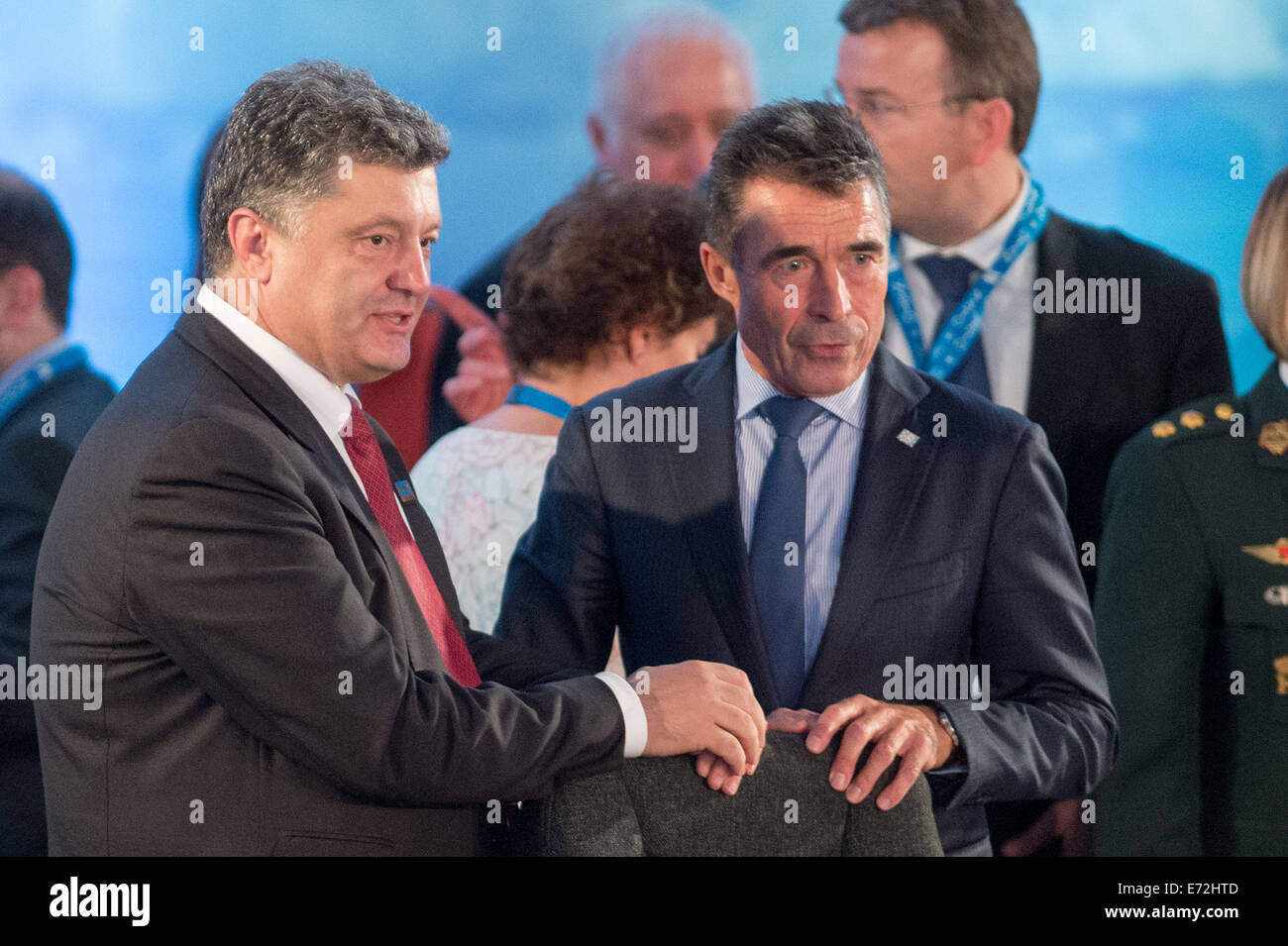 Newport, South Wales. 4th Sep, 2014. NATO General Secretary Anders Fogh Rasmussen (R) and Ukranian President Petro Poroshenko talk prior to the NATO-Ukraine Commission meeting during the NATO summit in Newport, South Wales, 4 September 2014. World leaders from about 60 countries are coming together for a two-day NATO summit taking place from 04-05 September 2014. PHOTO: MAURIZIO GAMBARINI/dpa/Alamy Live News Stock Photo