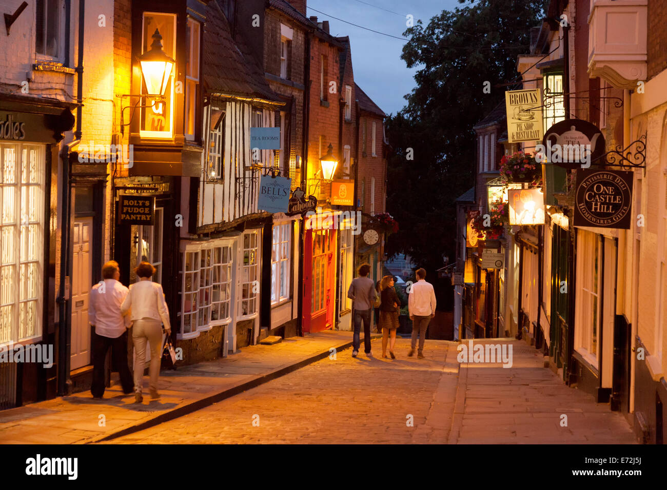 People walking on Steep Hill, Lincoln city centre at night, Lincoln, UK Stock Photo Alamy