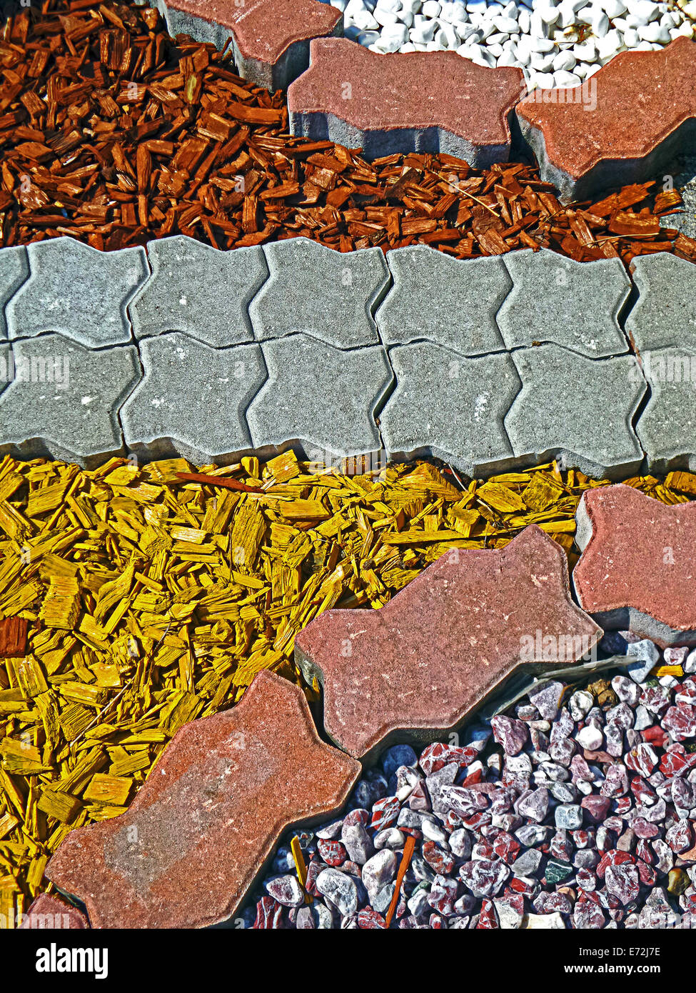 Paving garden ornaments with stone and wood chips colored Stock Photo