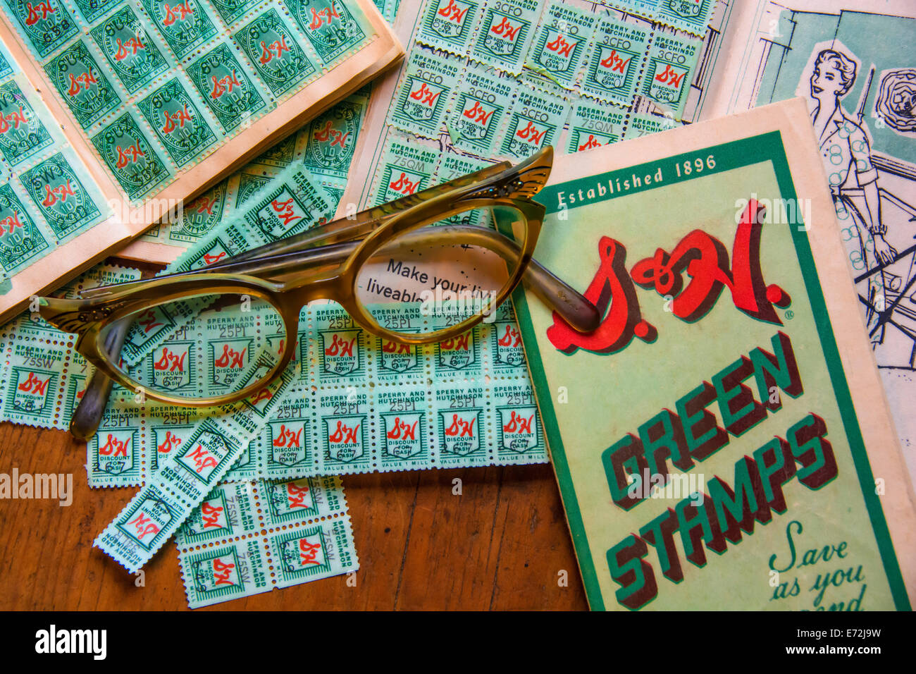 Catching up filling books with S&H Green Stamps in the 1950s Stock