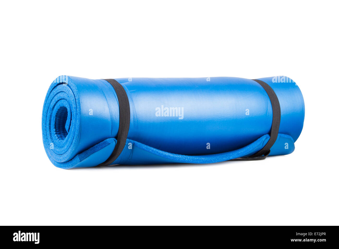 Blue rolled yoga mat for exercise, isolated on white background. Stock Photo