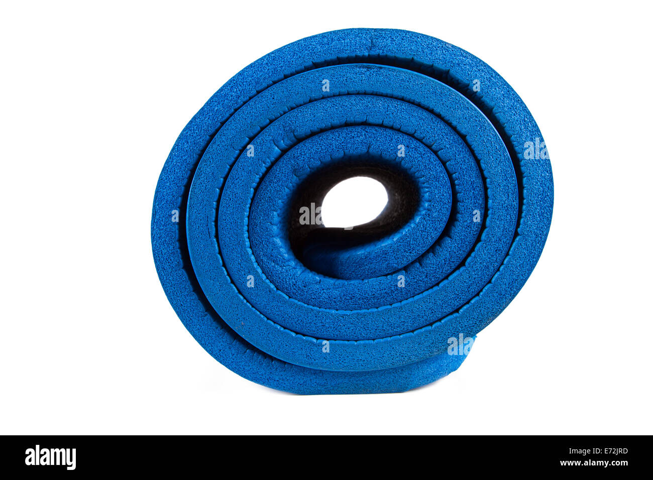 Side view of rolled blue yoga mat, isolated on white background. Stock Photo