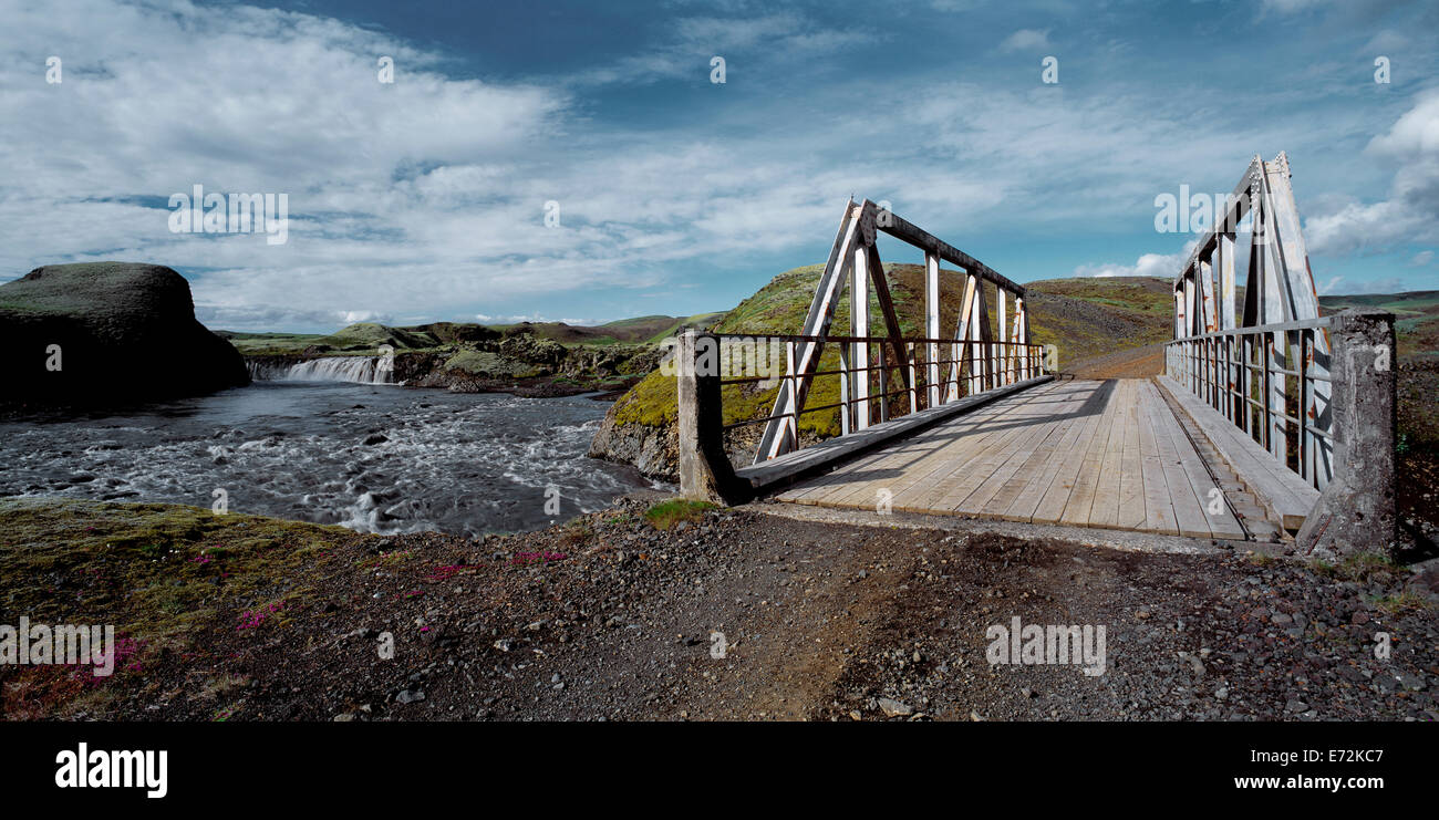 single track bridge over a glacial river close to the Myrdalsjokull glacier Stock Photo