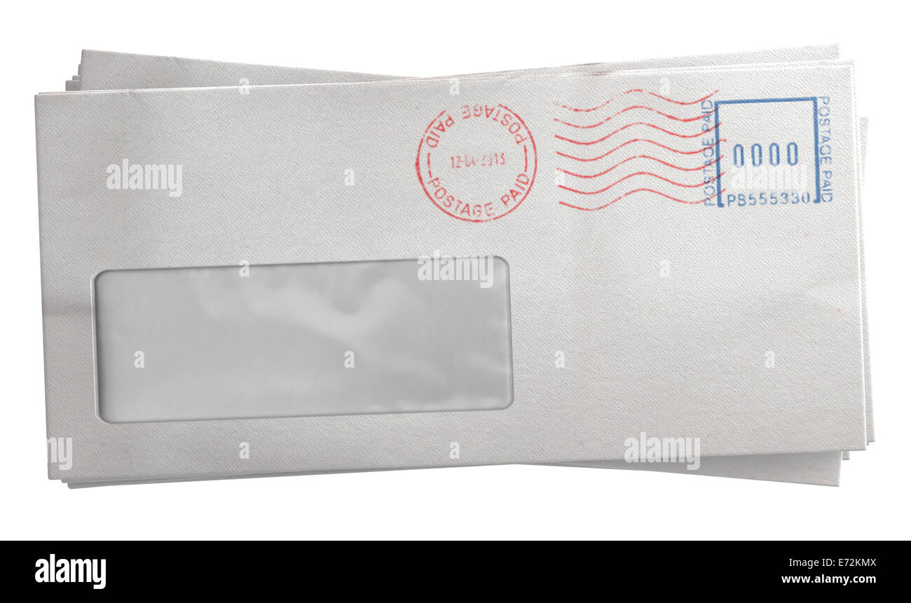 A stack of regular white envelopes with delivery stamps and a clear window on an isolated white background Stock Photo