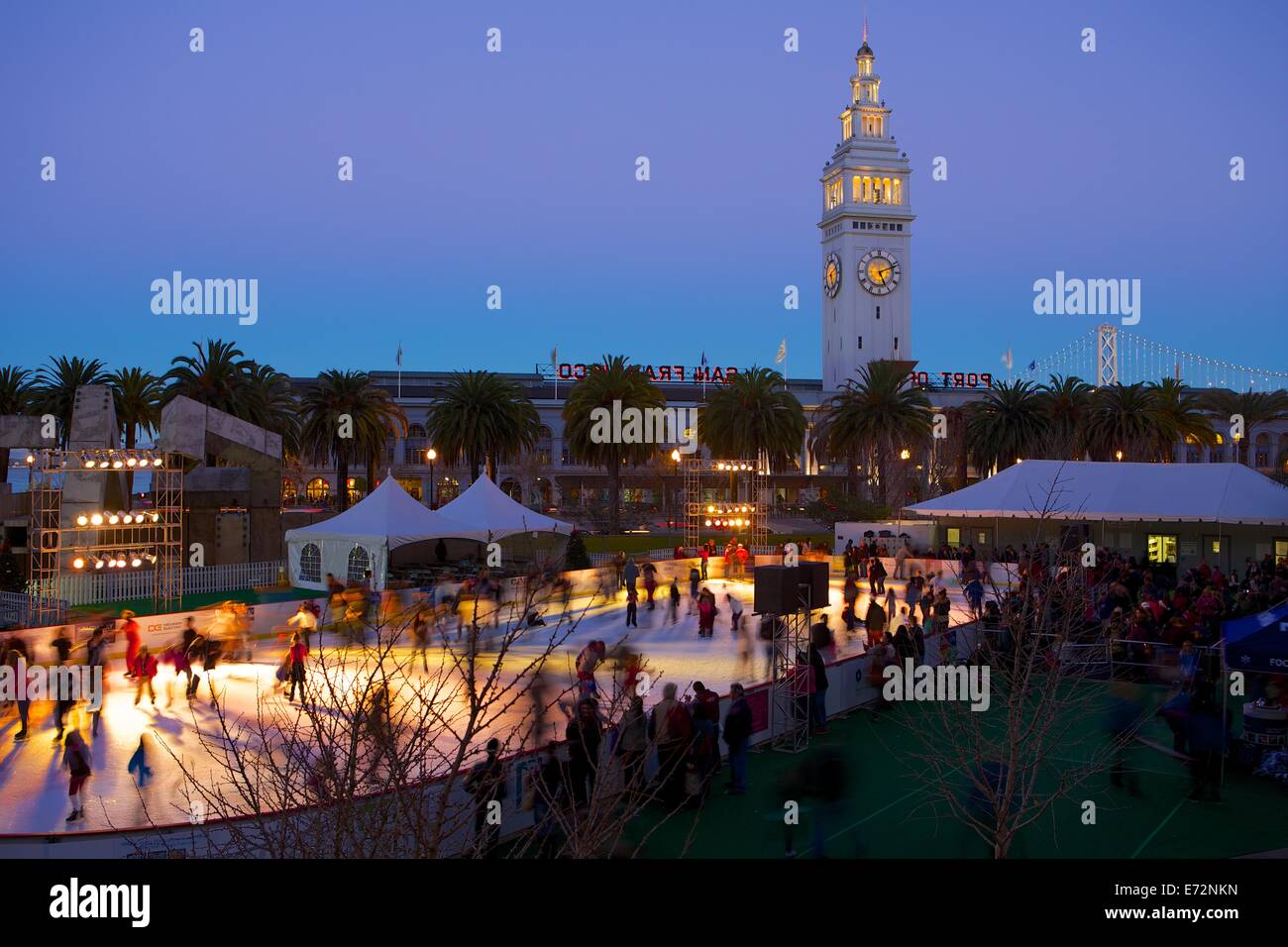 Ice skaters at the Justin Herman Plaza ice skating rink near the Ferry Building in San Francisco, California Stock Photo