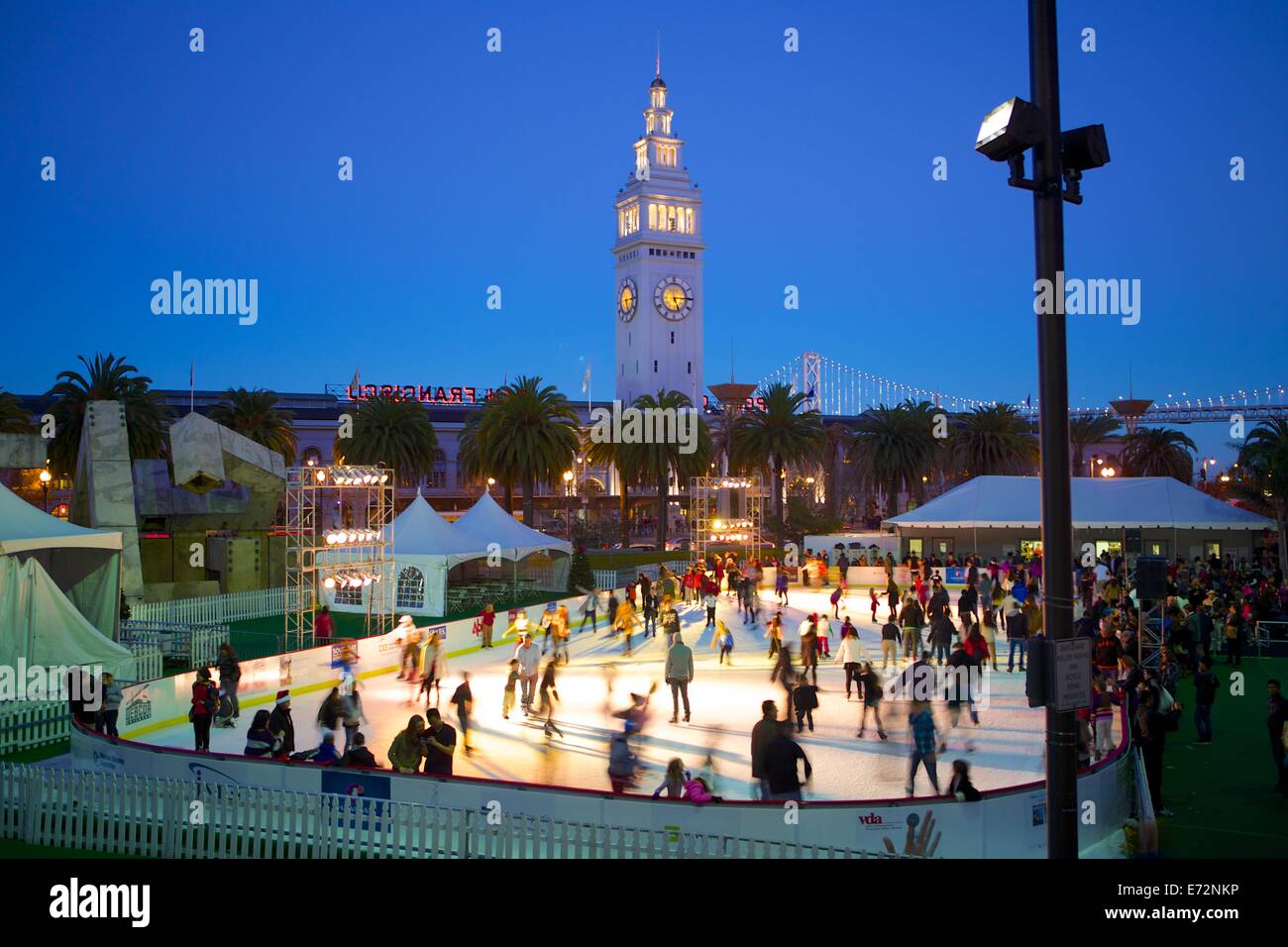 Ice skaters at the Justin Herman Plaza ice skating rink near the Ferry