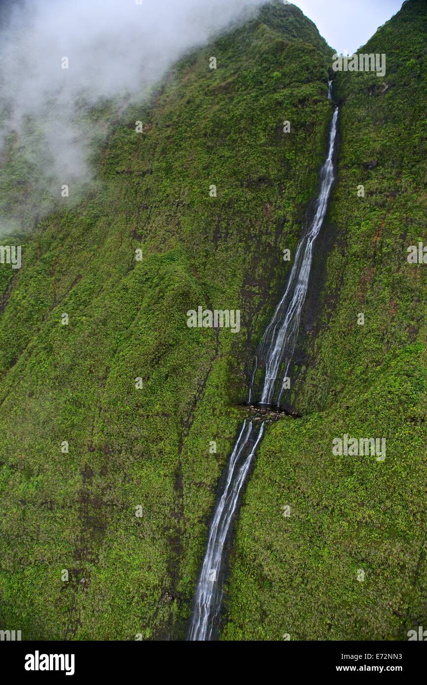 Aerial views of mountains and waterfalls from a helicopter in Kauai Stock Photo