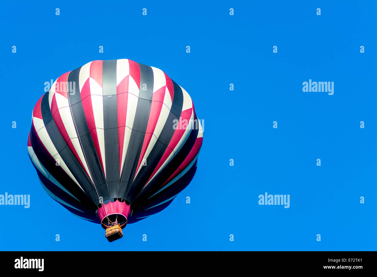 Single hot air balloon and blue sky Stock Photo - Alamy