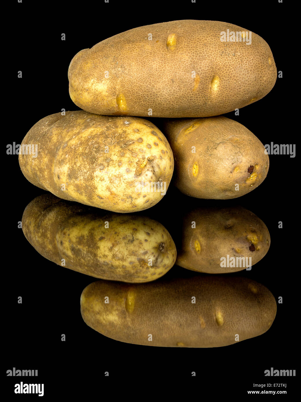 Russet potatoes stacked and ready to cook Stock Photo Alamy